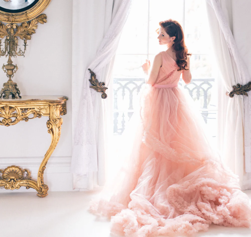 Bride looking out window